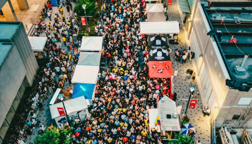 People on Dundas Place as an outdoor festival occurs.